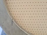 a close up of a chair with a hole in the back