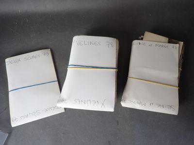 three notebooks with writing on them sitting on top of a table