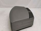 an image of a small gray computer sitting on top of a white surface