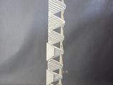 a sculpture of a tall tower made out of paper