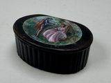 a small black box with a picture of a bird on it