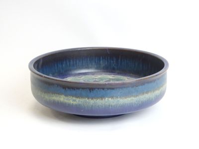 blue and green ceramic bowl on white background with white background