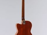 an acoustic guitar hanging from the ceiling