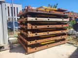 a stack of wooden pallets sitting on the ground