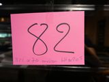 a pink post it note with the number 82 on it
