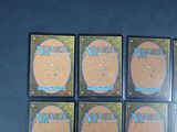 four decks of magic the gathering card game are shown on a table