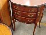 a small table with a drawer on top of it