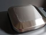 a metal container sitting on top of a table