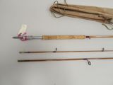 several different types of fishing rods on a white surface