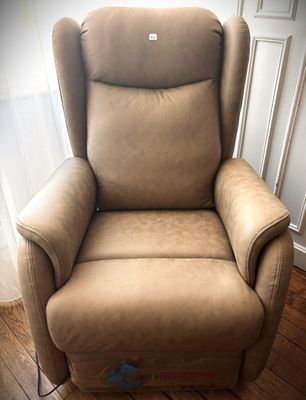 a reclining chair in the corner of a room