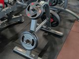 a gym with a lot of machines in the room
