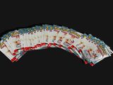 a lot of pokemon cards on a black background