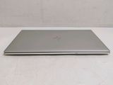 an open laptop computer sitting on top of a white table