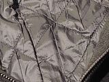 a close up of a jacket with a zipper on it