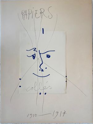 drawing of a face on a piece of paper with writing on it