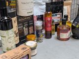 many bottles of wine and spices on the counter