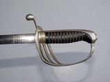 a close up of a sword with a metal handle