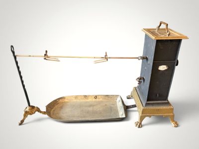 an old fashioned stove and a small boat on a stand