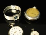 three different types of watches on a black surface