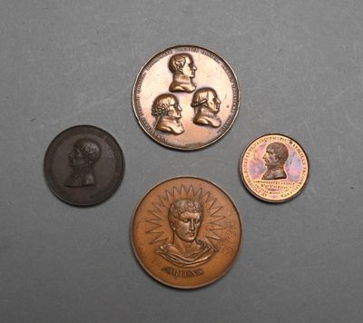 three different types of coins sitting on top of a table