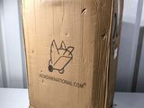 a cardboard box with a logo on it sitting on a table