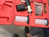 a red case with tools in it on the floor