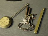 a picture of a clock and a key on a table
