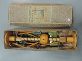a small box with a wooden handle and a wooden handle in it