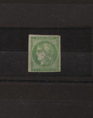 le timbre est vert et représente une femme