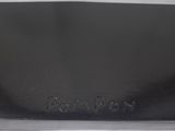 a close up of a black purse with a name engraved on it