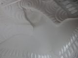 a white plate with a bird design on it