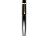 a close up of a pen on a white surface with a white background