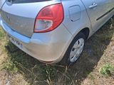 a silver car that is parked in the grass