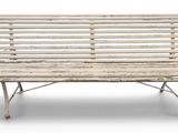 a wooden bench that is sitting on a white surface