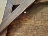 a close up of a wooden frame with a picture on it