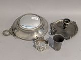 a silver plate with a silver cup and a silver plate with a silver cup and a silver plate with a silver cup and a silver plate with a silver