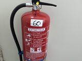 a fire extinguisor attached to a wall