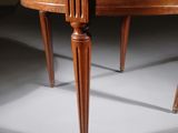 a round table with two legs and a wooden top
