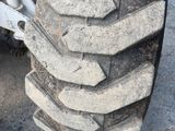 a close up of a large tire on a truck