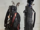 two golf clubs and a bag on the floor