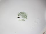 a white plate with a picture of a tree on it