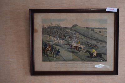 a picture of a painting of a horse race on the wall