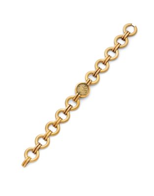 a gold link bracelet with a coin on it