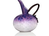 a purple and white glass vase on a white surface