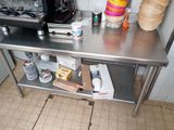 a stainless steel table with a bunch of items on it