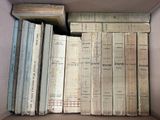 a box full of old books sitting on a table