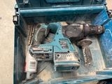a blue tool box with tools in it on the floor
