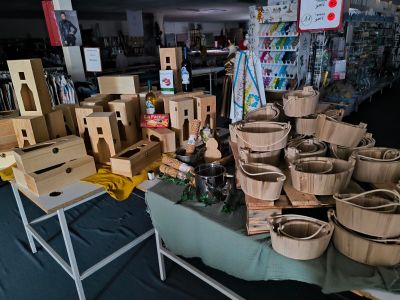 a table with baskets and boxes on it in a store