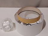 a picture of a white bowl with a yellow band on it