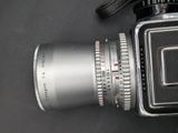 a close up of a camera with a lens attached to it